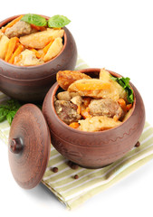 Homemade beef stir fry with vegetables in pots isolated on