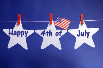 Happy Fourth of July stars from pegs on a line bunting