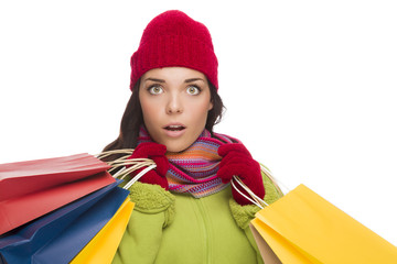 Mixed Race Woman Wearing Hat and Gloves Holding Shopping Bags
