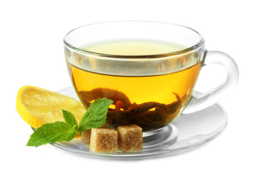 Transparent cup of green tea with lemon and mint isolated
