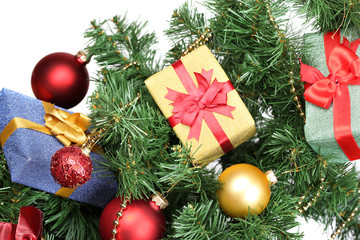 Fototapeta na wymiar Gifts on Christmas tree on room background