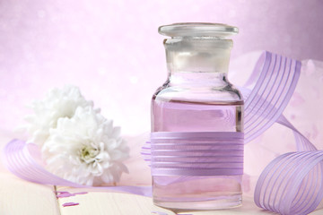 Fototapeta na wymiar Glass bottles with color essence, on light background