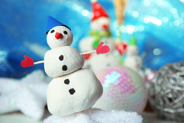 Beautiful snowmen and Christmas decor, on bright background