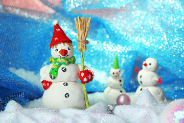 Beautiful snowmen and Christmas decor, on bright background