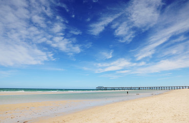 Fototapeta na wymiar Beautiful blue sky over wide sandy beach