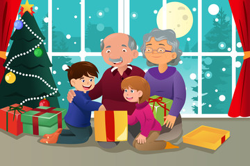Obraz na płótnie Canvas Kids opening Christmas present from grandparents