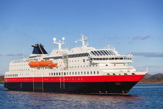 Big Norwegian passenger cruise ship goes on fjord