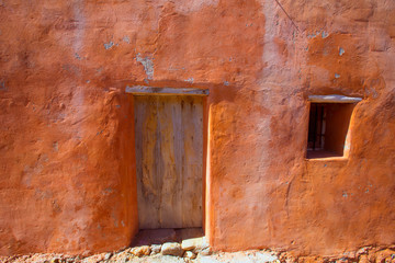 Ibiza grunge orange facade in Benirras beach