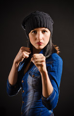 Young beautiful woman ready to fight