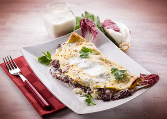 crepes with chicory and cheese, selective focus