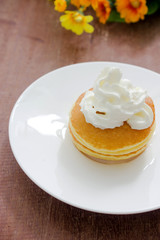 Pancakes with vanilla syrup and whipped cream