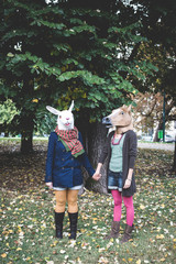horse and rabbit mask women in the park