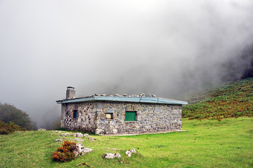 shelter in the mountain with fog