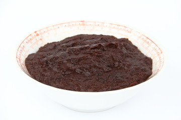 The jam in bowl on the white background