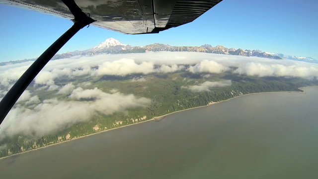 Aerial cloud view of distant Mt Redoubt Aleutian mountain range Alaskan Wilderness, Alaska, USA