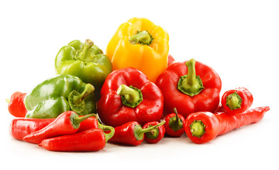 Composition with assorted peppers isolated on white background