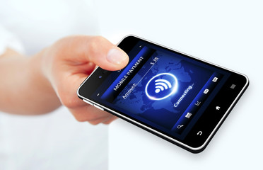 hand holding phone with mobile payment connection