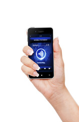 hand holding phone with mobile payment connection