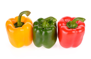 Red Green and Yellow peppers isolated on white background