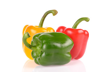 Red Green and Yellow peppers isolated on white background