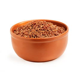 Brown rice in a ceramic bowl.