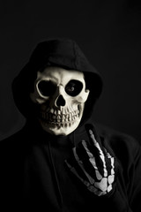 Scary skeleton beckoning you over.