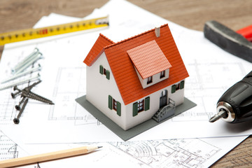 Scale model of house with tools
