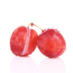 Plums on white background