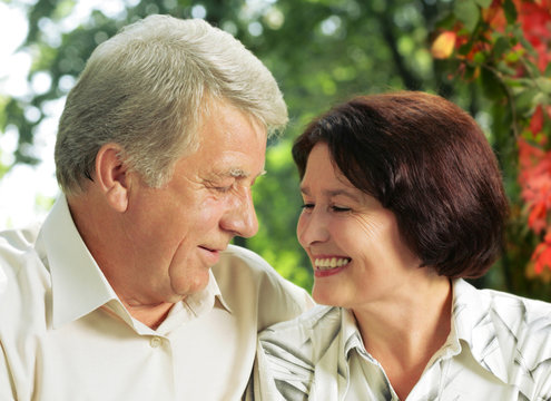 Senior happy couple embracing, outdoors