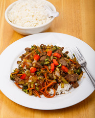 Plate of Beef Stir-fry and Bowl of Rice