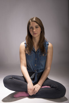 Beautiful young model with brown hair, slim and youthful