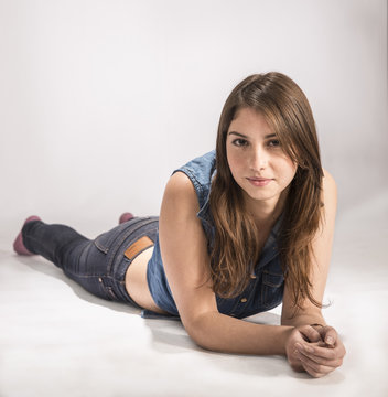 Beautiful young model with brown hair, slim and youthful