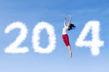 Woman dancing with new year 2014