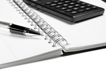 calculator notebook and business pen