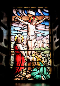 Colorful window with the image of the crucified Jesus