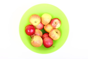 Fresh green, red apples in basket isolated