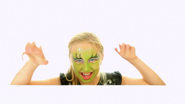 Scary little green girl for Halloween - trick or treat