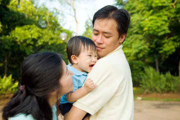 Fototapeta premium Asian parent playing with baby