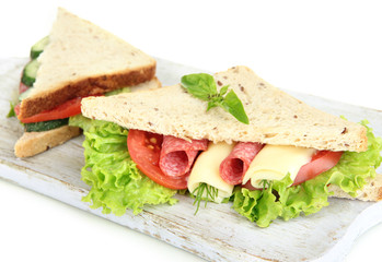 Tasty sandwiches with salami sausage and vegetables