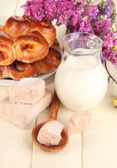 Dry yeast with pastry on wooden table close-up