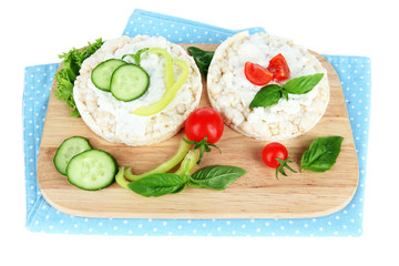 Tasty crispbreads with vegetables, isolated on white