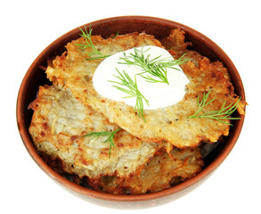Potato pancakes in bowl, isolated on white