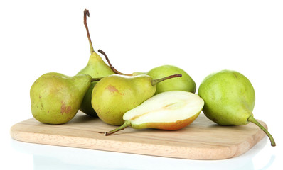 Pears on wooden cutting board, isolated on white