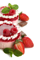 Delicious berry cakes isolated on white