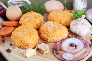Meat patties on board close-up