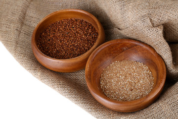 Buckwheat and flour in bowls closeup