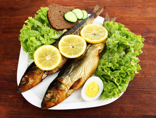 Smoked fish on plate close up