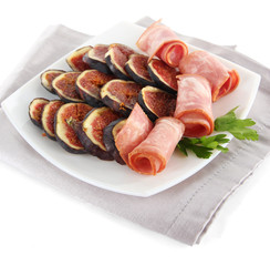 Tasty figs with ham, isolated on white