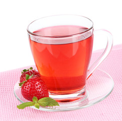 Delicious strawberry tea on table on white background