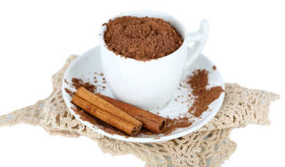 Cocoa powder in cup with saucer on napkin isolated on white